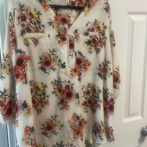 Woman’s floral zip down blouse